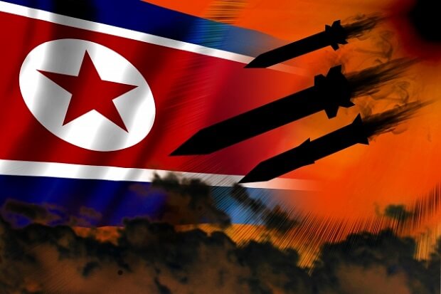 北朝鮮国旗とミサイルのシルエット
